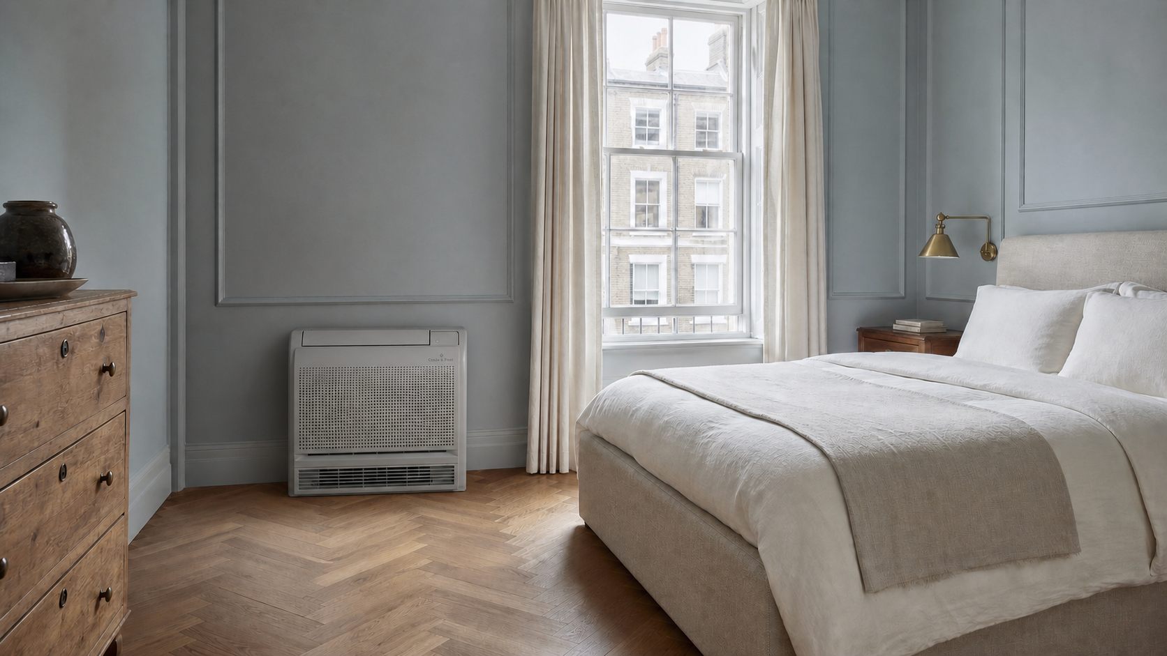Coole & Frost floor unit against the panelled wall of a London guest bedroom, where the radiator used to be