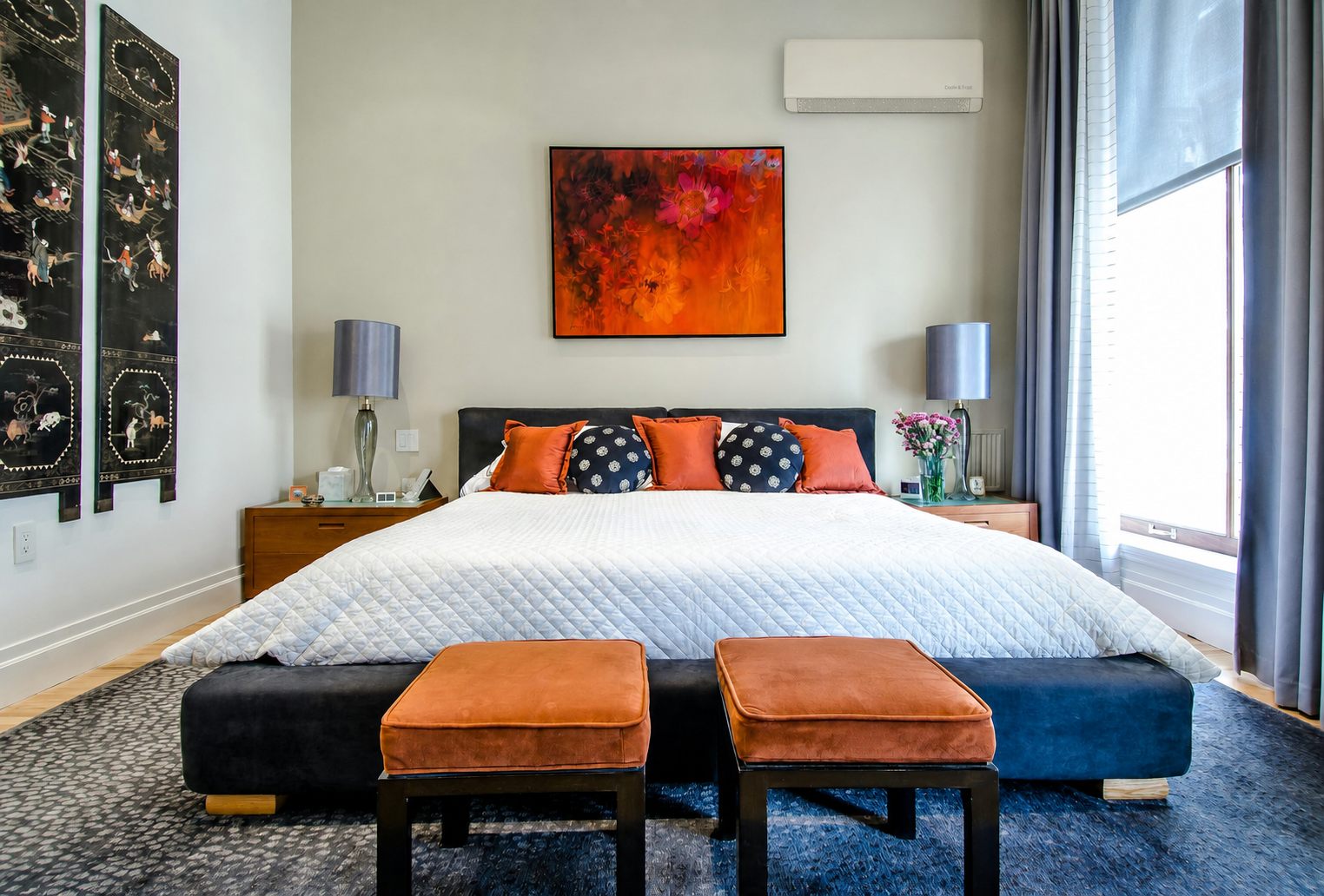 A bright bedroom kept cool and fresh — the unit quietly cleans its own coil and filters the air