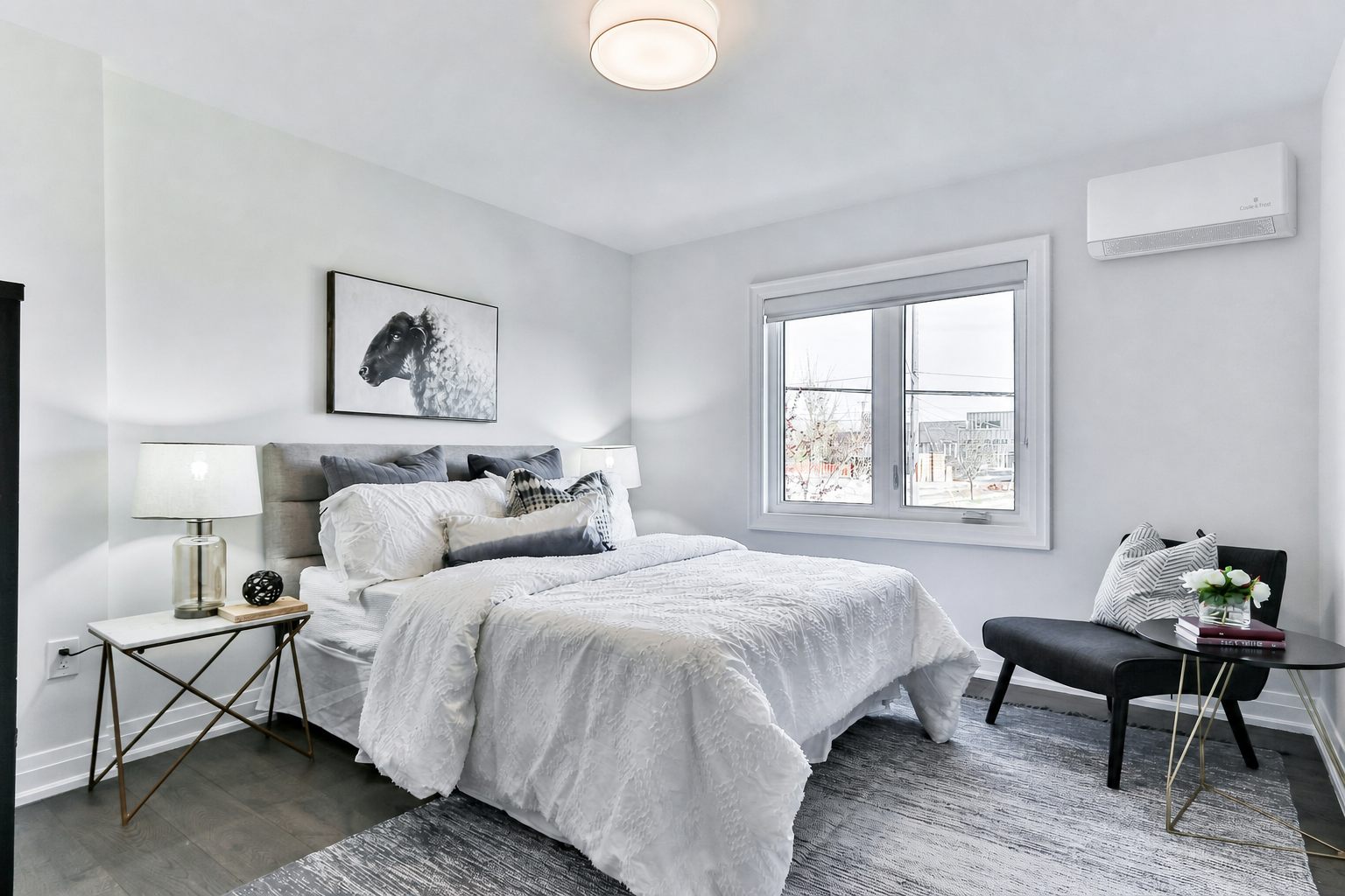 Slim wall unit mounted high on the wall of a calm grey bedroom