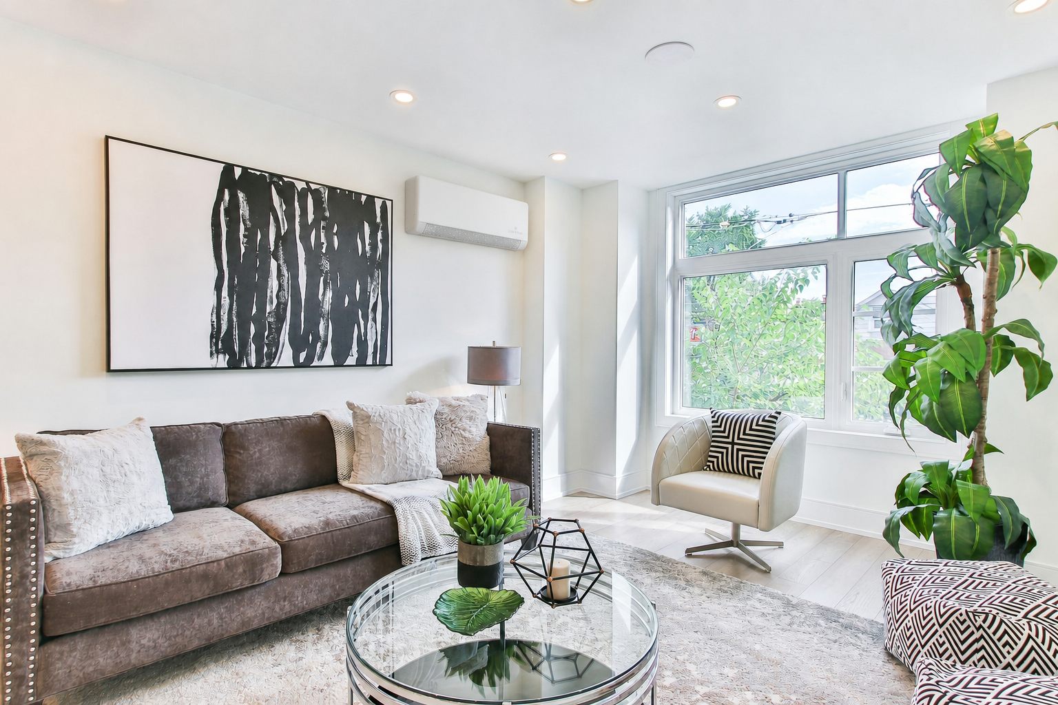 Slim wall unit mounted high in a London living room with bay window